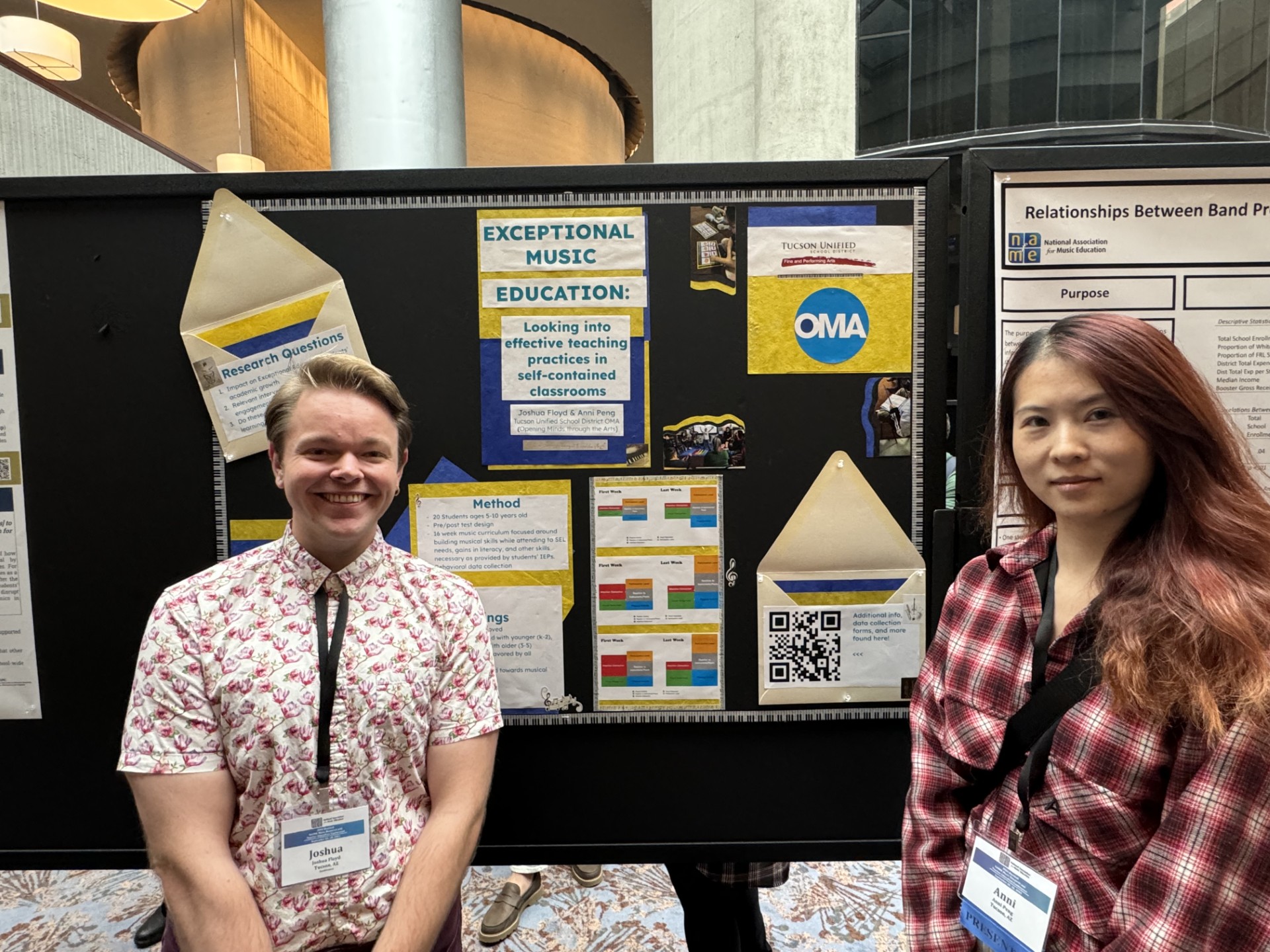 Joshua Floyd and Anni Peng stand in front of their presentation on Exceptional Music Education